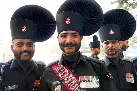 Members of the Rajputana Rifles’ marching contingent pose for photographs during rehearsals for the Republic Day Parade, in Kolkata, West Bengal.