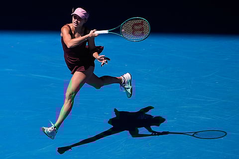 Anastasia Potapova of Austria plays a forehand return to Aryna Sabalenka of Belarus during their third round match at the Australian Open tennis championship in Melbourne, Australia.