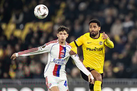Young Boys' Paavel Sulc, right, and Lyon's Khalis Merah challenge for the ball during the Europa League opening phase soccer match between Young Boys and Olympique Lyonnais, in Bern, Switzerland.
