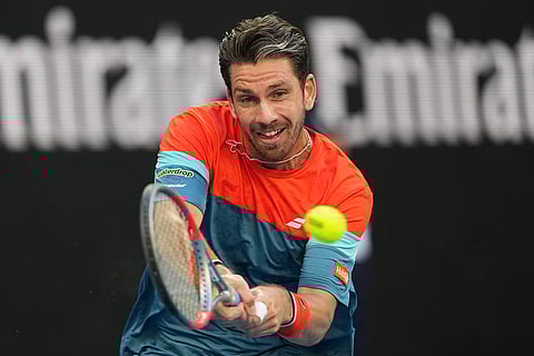 Cameron Norrie of Britain plays a backhand return to Alexander Zverev of Germany during their third round match at the Australian Open tennis championship in Melbourne, Australia.
