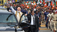 | Photo: PMO via PTI : In this image released on Jan. 23, 2026, Prime Minister Narendra Modi greets people during a roadshow upon his arrival, in Thiruvananthapuram.