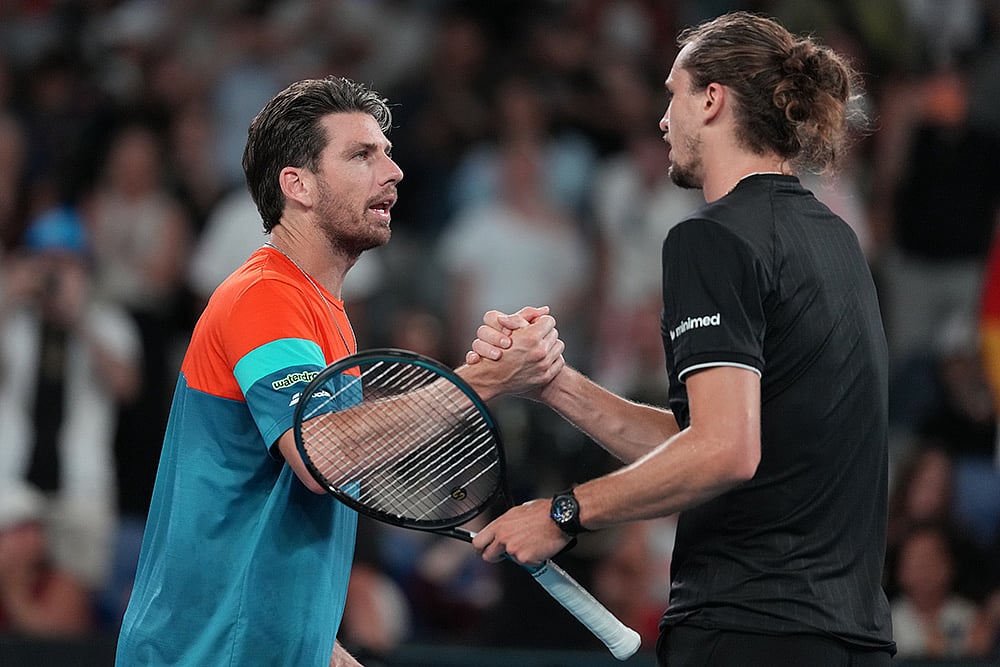 Alexander Zverev, right, of Germany is congratulated by Cameron Norrie, left, of Britain following their third round match at the Australian Open tennis championship in Melbourne, Australia. - | Photo: AP/Aaron Favila