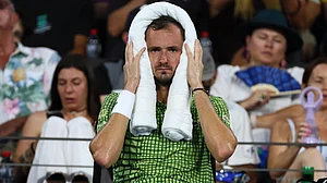 | Photo: AP/Tertius Pickard : Daniil Medvedev of Russia uses an iced towel during the men's final match against Brandon Nakashima of the United States at the Brisbane International tennis tournament in Brisbane, Australia, Sunday, Jan. 11, 2026.