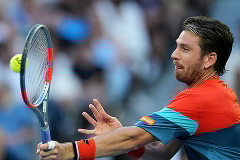 Cameron Norrie of Britain plays a forehand return to Alexander Zverev of Germany during their third round match at the Australian Open tennis championship in Melbourne, Australia.