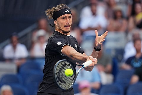 Alexander Zverev of Germany plays a forehand return to Cameron Norrie of Britain during their third round match at the Australian Open tennis championship in Melbourne, Australia.