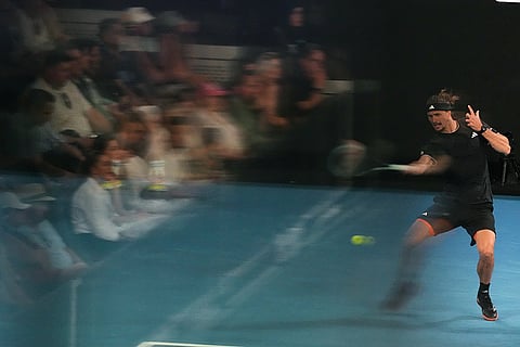 Alexander Zverev of Germany plays a forehand return to Cameron Norrie of Britain during their third round match at the Australian Open tennis championship in Melbourne, Australia.
