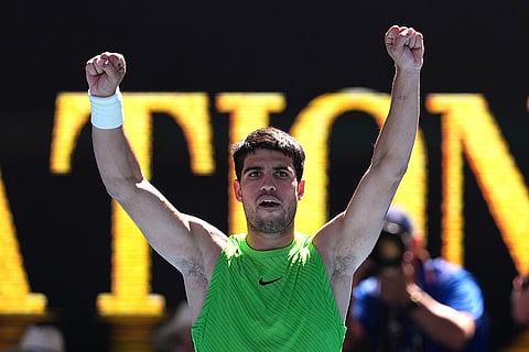 Carlos Alcaraz of Spain reacts after defeating Corentin Moutet of France in their third round match at the Australian Open tennis championship in Melbourne, Australia.