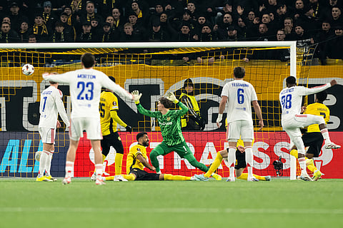 Lyon's Ainsley Maitland-Niles, second from right, scores the opening goal during the Europa League opening phase soccer match between Young Boys and Olympique Lyonnais, in Bern, Switzerland.