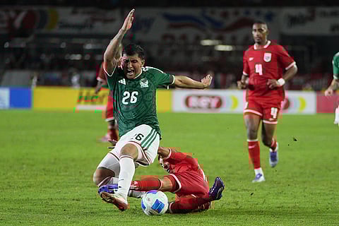 Panama's Omar Cordoba tackles Mexico's Bryan Gonzalez during an international friendly soccer match in Panama City.