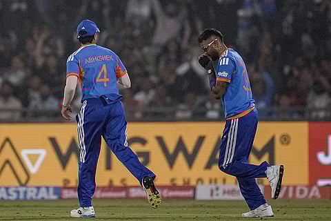 India's Hardik Pandya, right, celebrates with teammate Abhishek Sharma after taking the catch of New Zealand's Devon Conway during the second T20I cricket match between India and New Zealand, at Shaheed Veer Narayan Singh International Cricket Stadium, in Raipur, Chhattisgarh.