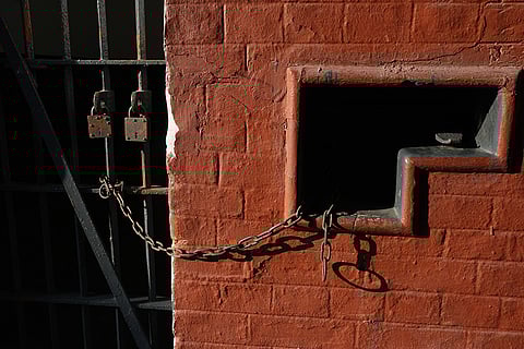 This image displays the entrance to a cell at the Alipore Jail Museum in Kolkata. 