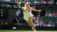 | Photo: AP/Alberto Pezzali : Croatia's Jana Fett stretches to return to Poland's Iga Swiatek in a first round women's singles match on day two of the Wimbledon tennis championships in London, Tuesday, June 28, 2022.