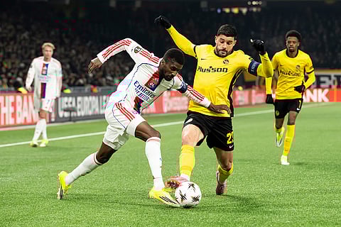 Lyon's Clinton Mata, left, and Young Boys' Loris Benito challenge for the ball during the Europa League opening phase soccer match between Young Boys and Olympique Lyonnais, in Bern, Switzerland.