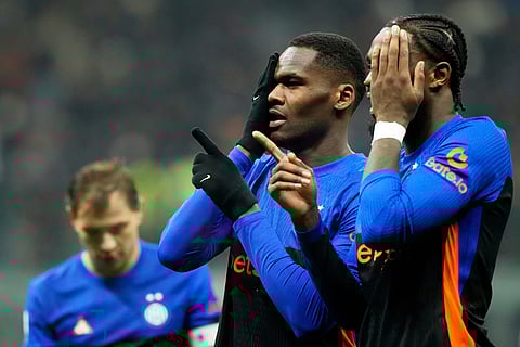 Inter Milan's Ange-Yoan Bonny, center, celebrates with Inter Milan's Marcus Thuram after scoring his side's fifth goal during a Serie A soccer match between Inter Milan and Pisa, in Milan, Italy.