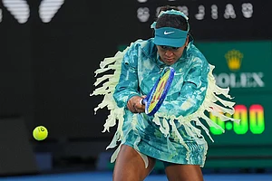 | Photo: AP/Dita Alangkara : Naomi Osaka of Japan warms-up for her second round match against Sorana Cirstea of Romania at the Australian Open tennis championship in Melbourne, Australia, Thursday, Jan. 22, 2026.