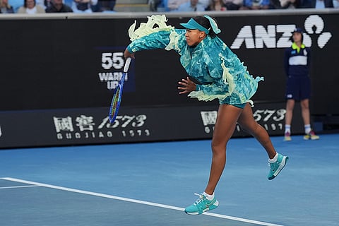 Naomi Osaka of Japan warms-up for her second round match against Sorana Cirstea of Romania at the Australian Open tennis championship in Melbourne, Australia, Thursday, Jan. 22, 2026.