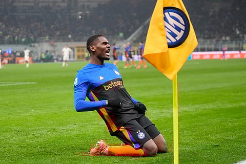 Inter Milan's Ange-Yoan Bonny celebrates after scoring his side's fifth goal during a Serie A soccer match between Inter Milan and Pisa, in Milan, Italy.