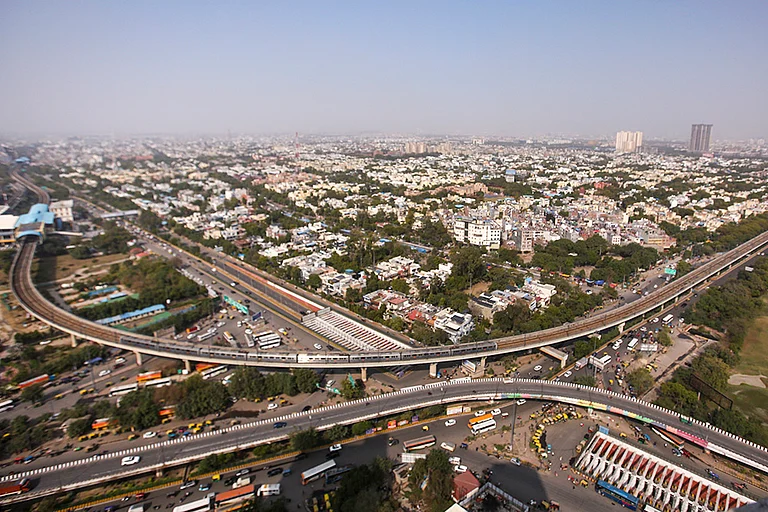 An aerial view of the city after air quality improved following rainfall at Sector 37 in Noida, Uttar Pradesh. - | Photo: PTI