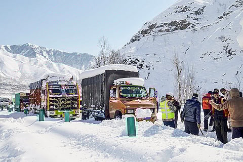 Vehicles stuck on the snow-covered Jammu-Srinagar National Highway after heavy snowfall, near Banihal in Ramban district, Jammu and Kashmir. The highway remained closed for the second consecutive day as Banihal received more snowfall compared to the Kashmir valley. 