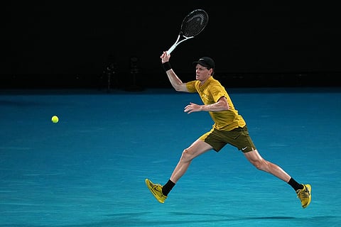 Jannik Sinner of Italy plays a forehand return to Eliot Spizzirri of the U.S. during their third round match at the Australian Open tennis championship in Melbourne, Australia.