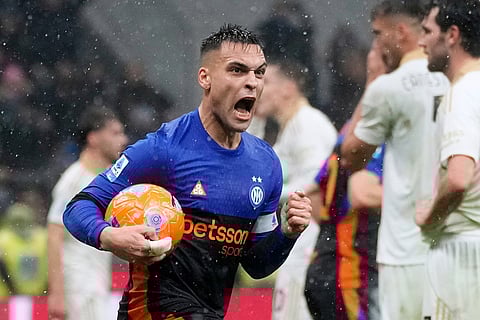Inter Milan's Lautaro Martinez celebrates after scoring his side's second goal during a Serie A soccer match between Inter Milan and Pisa, in Milan, Italy.