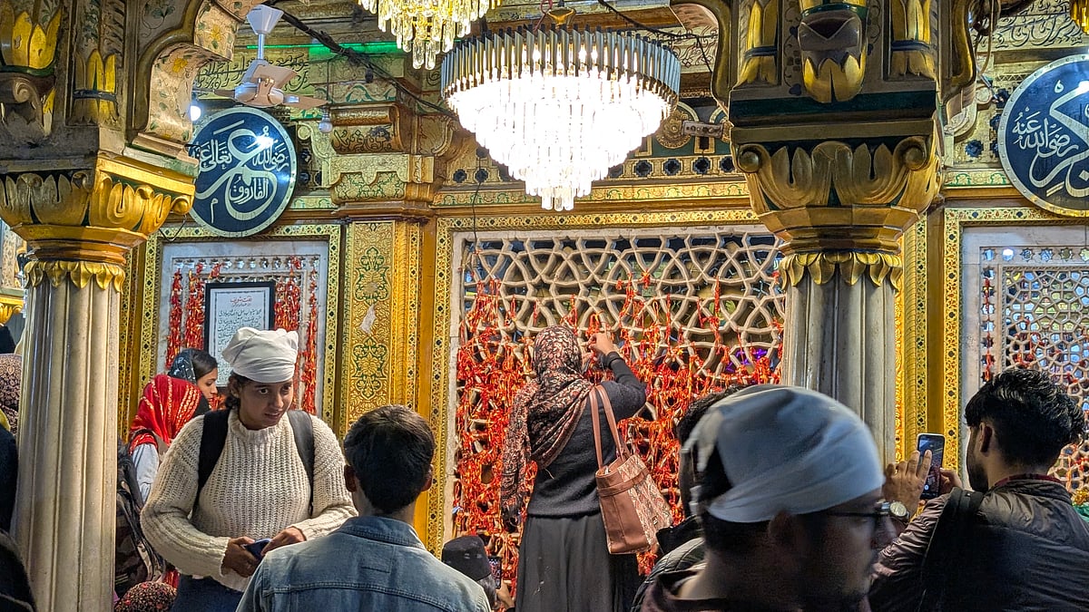 Women offer prayers at the shrine.
