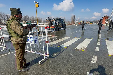 Security personnel keep vigil at the Jammu-Srinagar national highway ahead of Republic Day celebrations, near Wanpoh, in Kulgam district, Jammu and Kashmir.