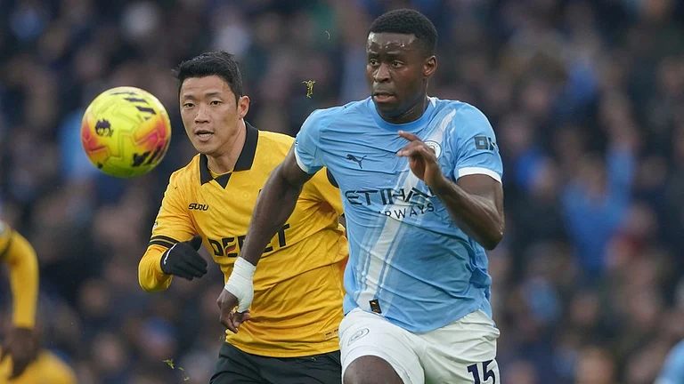 Manchester City's Marc Guehi, right, vies for the ball with Wolverhampton Wanderers' Hwang Hee-chan, during their English Premier League match. - Photo: AP