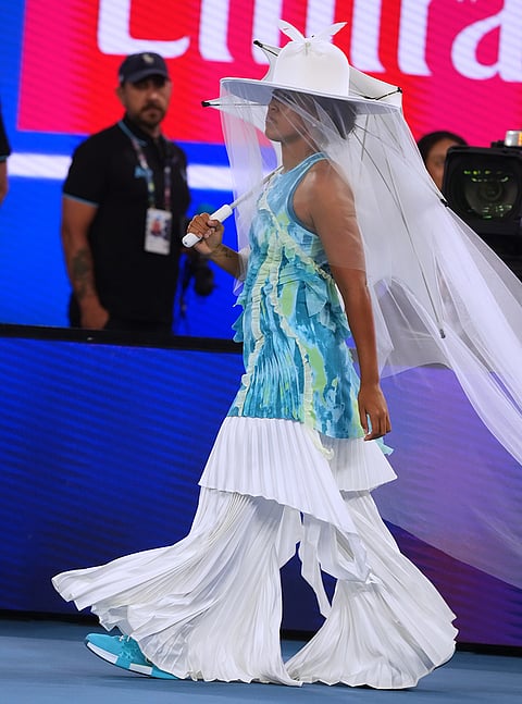 Naomi Osaka of Japan walks onto Rod Laver Arena for her first round match against Antonia Ruzic of Croatia at the Australian Open tennis championship in Melbourne, Australia.