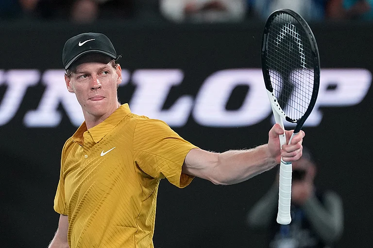 Jannik Sinner of Italy reacts after defeating Eliot Spizzirri of the U.S. in their third round match at the Australian Open tennis championship in Melbourne, Australia. - | Photo: AP/Dita Alangkara