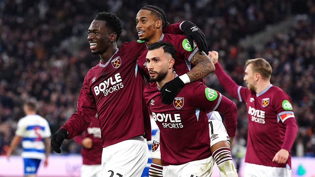 West Ham United's Crysencio Summerville, centre, celebrates scoring their side's first goal of the game with Taty Castellanos, right, and Soungoutou Magassa during the FA Cup third round match between West Ham United and Queens Park Rangers. - Photo: Bradley Collyer/PA via AP