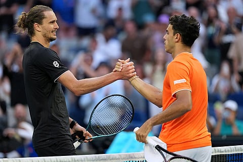 Alexander Zverev, left, of Germany is congratulated by Francisco Cerundolo, right, of Argentina following their fourth round match at the Australian Open tennis championship in Melbourne, Australia.