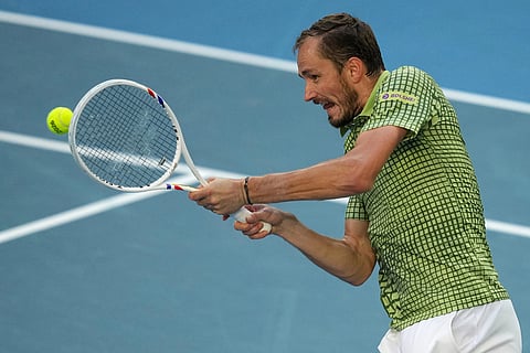 Daniil Medvedev of Russia plays a backhand return to Learner Tien of the U.S. during their fourth round match at the Australian Open tennis championship in Melbourne, Australia.