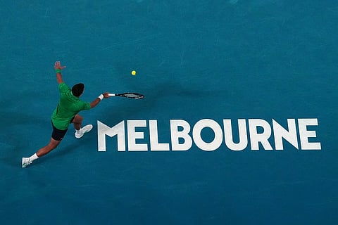 Novak Djokovic of Serbia plays a forehand return to Botic van de Zandschulp of the Netherlands during their third round match at the Australian Open tennis championship in Melbourne, Australia.