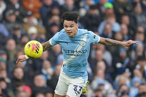Manchester City's Nico O'Reilly watches the ball during the English Premier League soccer match between Manchester City and Wolverhampton Wanderers in Manchester, England.