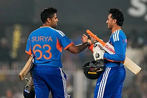 Photo: AP/Anupam Nath : India's captain Suryakumar Yadav, left, and India's Abhishek Sharma celebrate after winning the third T20 cricket match between India and New Zealand in Guwahati, India.