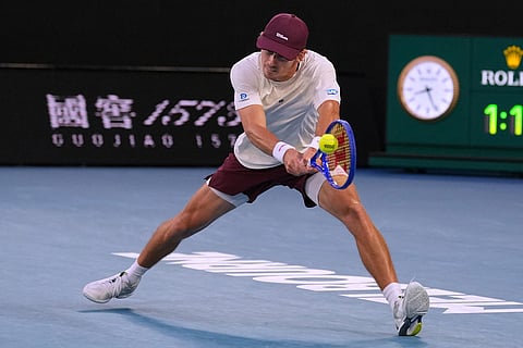 Alex de Minaur of Australia plays a backhand return to Alexander Bublik of Kazakhstan during their fourth round match at the Australian Open tennis championship in Melbourne, Australia.