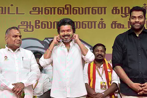 TVK Chief Vijay, centre, gestures during a state and district-level Executive Cadre Consultation Meeting, at Mamallapuram, in Chengalpattu district, Tamil Nadu.