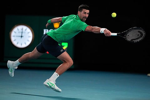 Novak Djokovic of Serbia plays a backhand return to Botic van de Zandschulp of the Netherlands during their third round match at the Australian Open tennis championship in Melbourne, Australia.