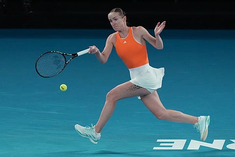 Elina Svitolina of Ukraine plays a forehand return to Mirra Andreeva of Russia during their fourth round match at the Australian Open tennis championship in Melbourne, Australia.