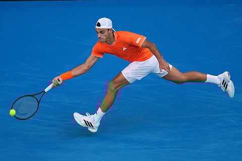 Francisco Cerundolo of Argentina plays a forehand return to Alexander Zverev of Germany during their fourth round match at the Australian Open tennis championship in Melbourne, Australia.