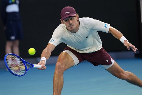 Alex de Minaur of Australia plays a forehand return to Alexander Bublik of Kazakhstan during their fourth round match at the Australian Open tennis championship in Melbourne, Australia.