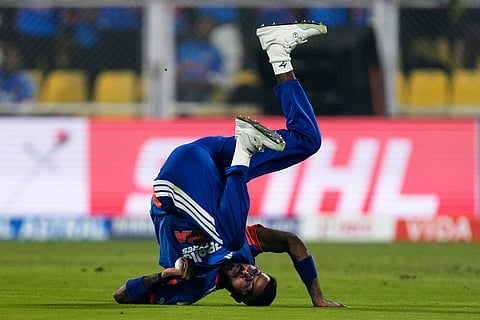 India's Hardik Pandya takes the catch to dismiss New Zealand's Devon Conway during the third T20 cricket match between India and New Zealand in Guwahati, India.