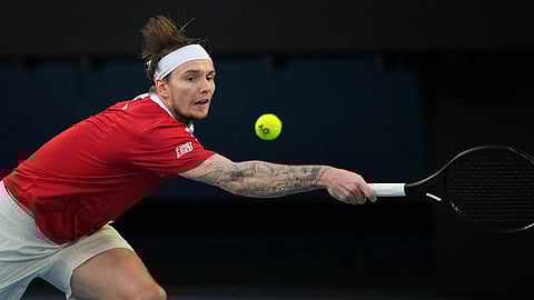 Alexander Bublik of Kazakhstan plays a backhand return to Alex de Minaur of Australia during their fourth round match at the Australian Open tennis championship in Melbourne, Australia.