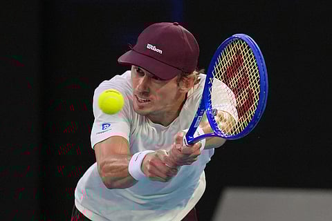 Alex de Minaur of Australia plays a backhand return to Alexander Bublik of Kazakhstan during their fourth round match at the Australian Open tennis championship in Melbourne, Australia.