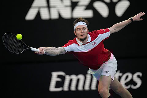 Alexander Bublik of Kazakhstan plays a forehand return to Alex de Minaur of Australia during their fourth round match at the Australian Open tennis championship in Melbourne, Australia.