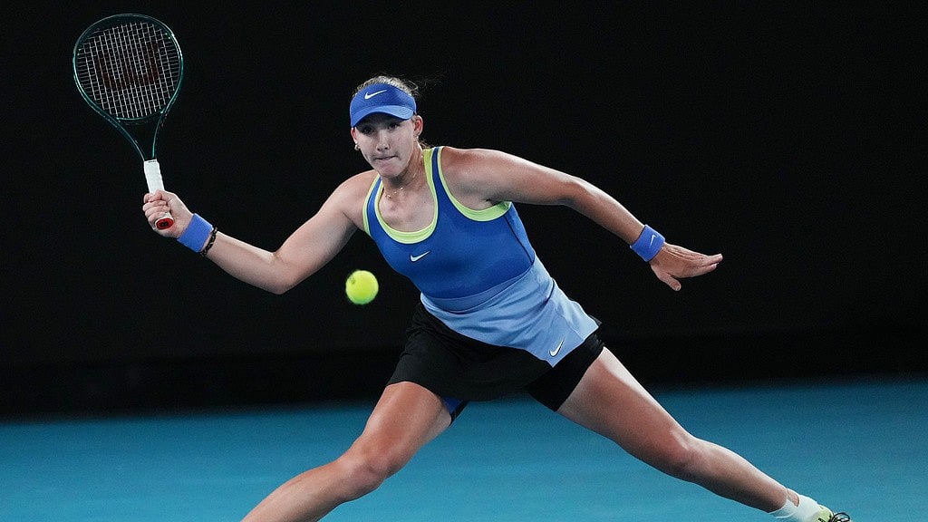 Mirra Andreeva of Russia plays a forehand return to Elena-Gabriela Ruse of Romania during their third round match at the Australian Open tennis championship in Melbourne. - Photo: AP