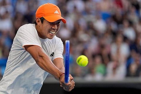Learner Tien of the U.S. plays a backhand return to Daniil Medvedev of Russia during their fourth round match at the Australian Open tennis championship in Melbourne, Australia.