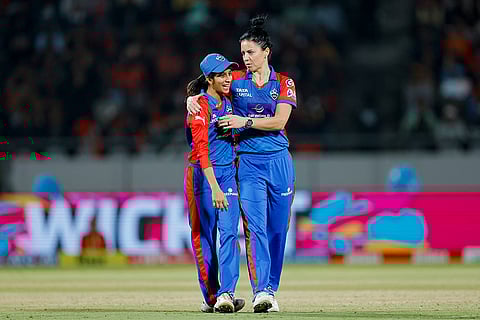 Delhi Capitals' Marizanne Kapp celebrates with captain Jemimah Rodrigues after taking the wicket of Royal Challengers Bengaluru's Georgia Voll during the Women's Premier League (WPL) 2026 T20 cricket match between Royal Challengers Bengaluru and Delhi Capitals, at BCA Stadium, in Vadodara, Gujarat.