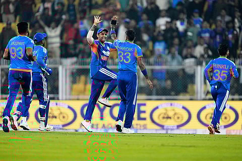 India's captain Suryakumar Yadav, third left, and Hardik Pandya, second right, celebrates the dismissal of New Zealand's Rachin Ravindra during the third T20 cricket match between India and New Zealand in Guwahati, India.